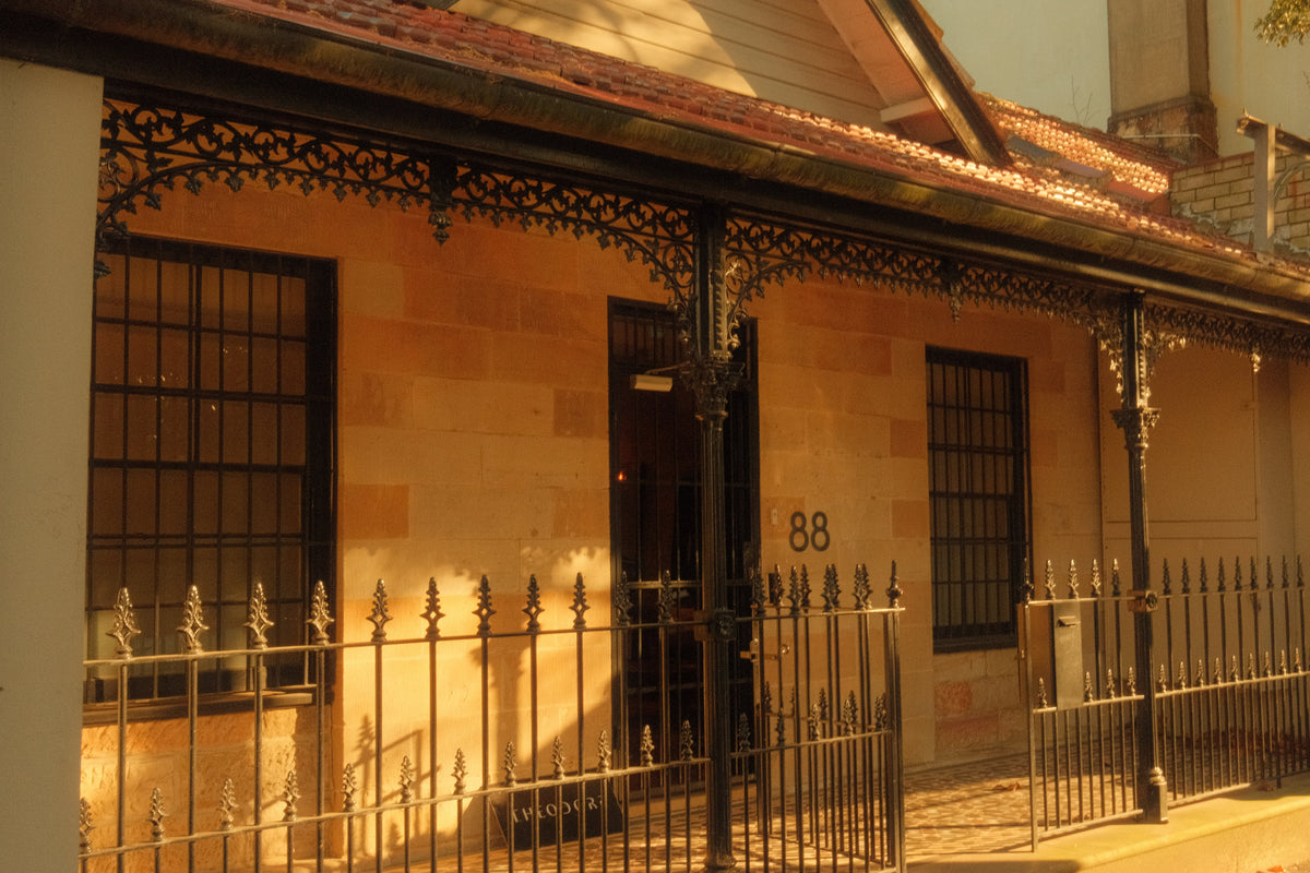 The sandstone terrace at 88 Pitt Street, Redfern, with its cast-iron verandah