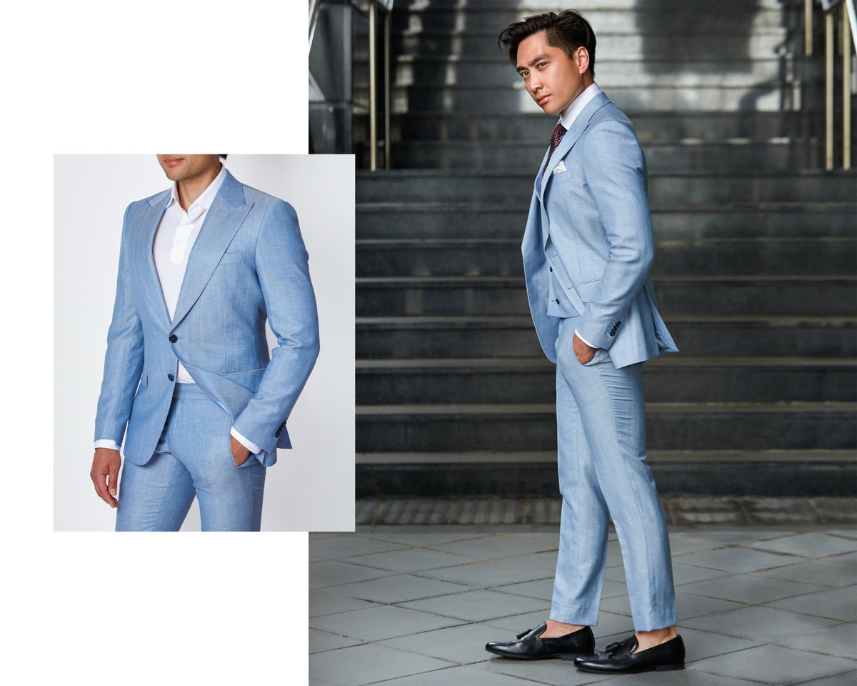 Two views of a pale blue THEODORE suit worn with a white shirt and burgundy tie, on stone steps