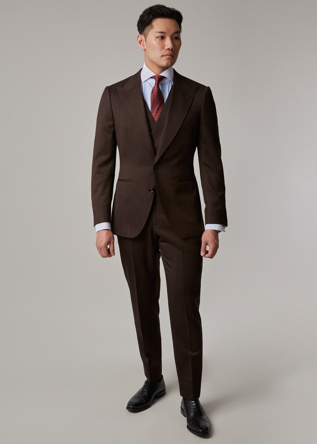 Elevate — Lexington Brown Suit worn buttoned with waistcoat and tie, full front view on a model