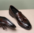 Lukas Dark Brown Leather Tassel Loafer, pair shown in a flat lay with tassel detail