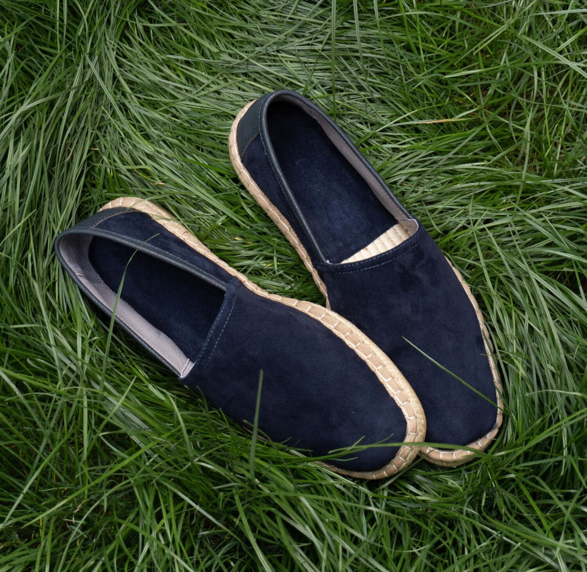 Aries Midnight Blue Handcrafted Woven Fisherman Shoes, pair resting on grass
