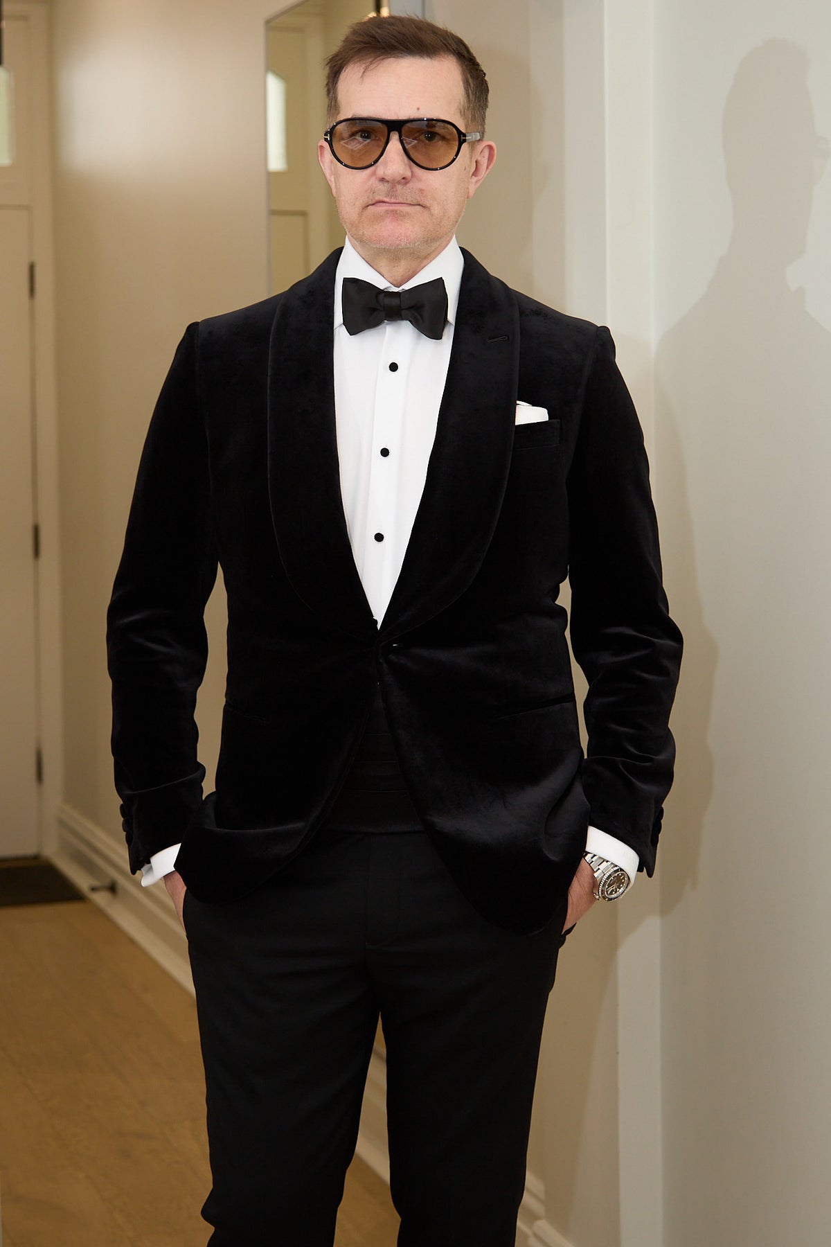 The Black Diamond Tux worn by a model in a hallway, closer crop