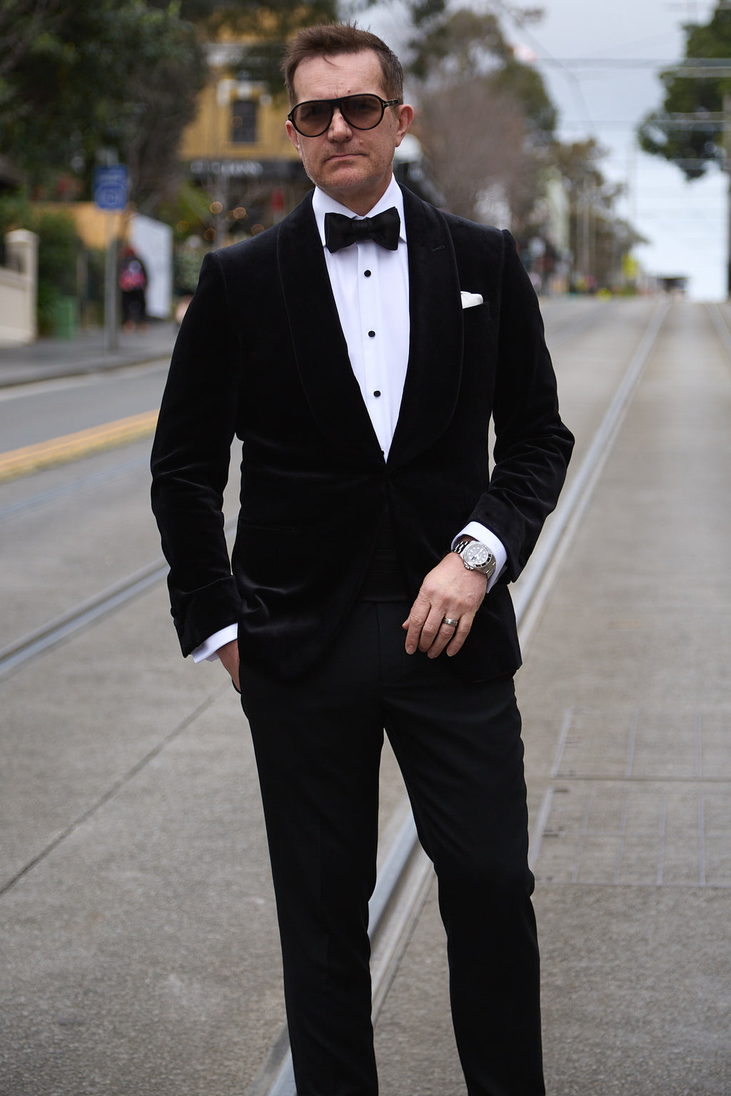 The Black Diamond Tux worn by a model standing on a city street