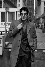Fast Break Tailored Set in black and white, model on a city street with an overcoat on top