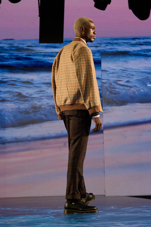 Brownstone Bomber Jacket, back view on a model standing on the runway stage