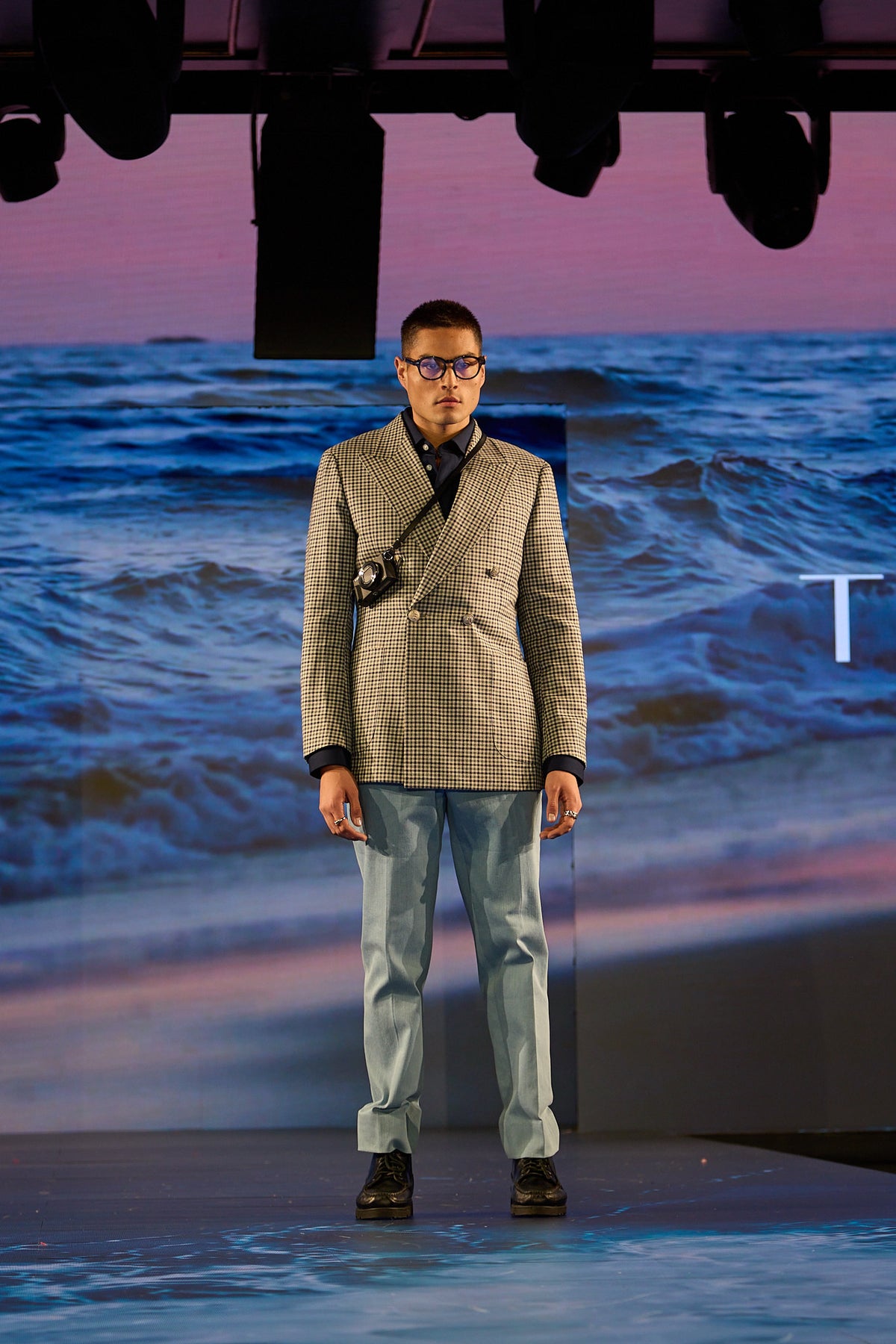 Glen Green Sports Jacket worn by a model walking a runway with an ocean backdrop