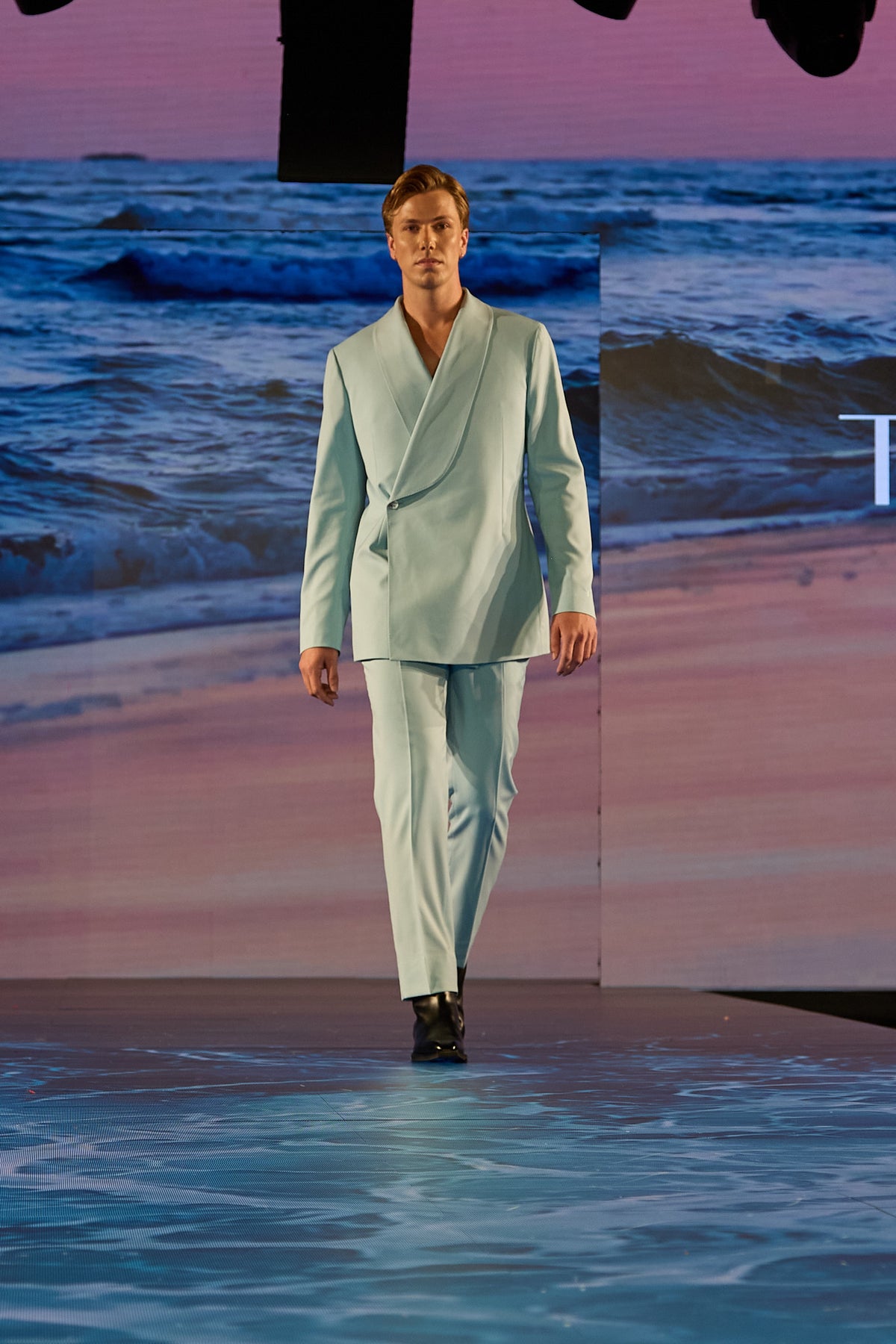Mint Martini Suit worn by a runway model, front view while walking