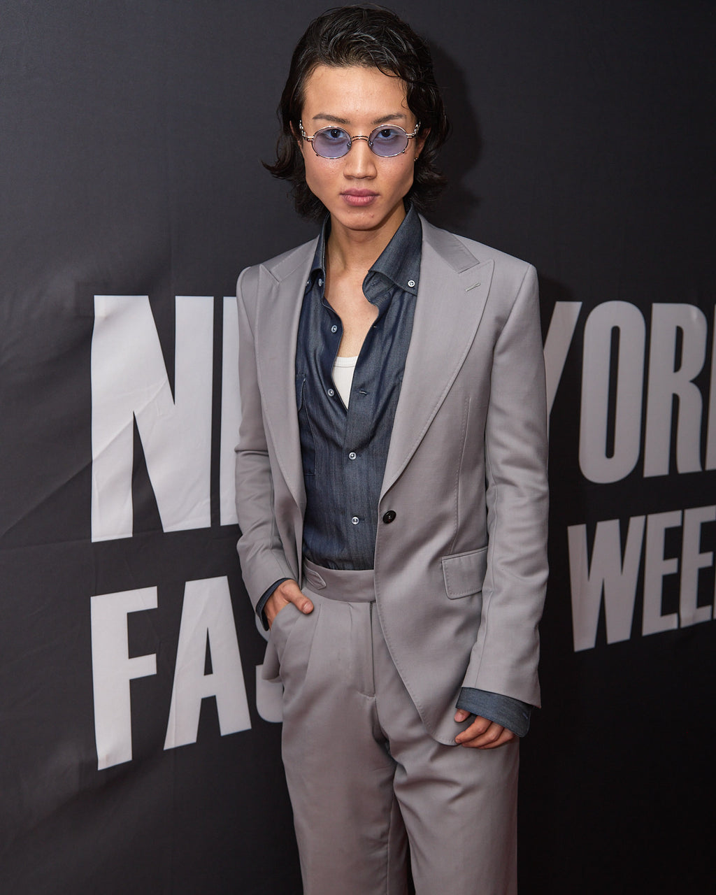 Zenith Grey Suit worn by a model, tighter crop at the same fashion week backdrop