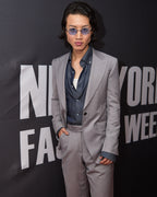 Zenith Grey Suit worn by a model, tighter crop at the same fashion week backdrop