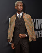 Brownstone Bomber Jacket, three-quarter view on a model at a media wall
