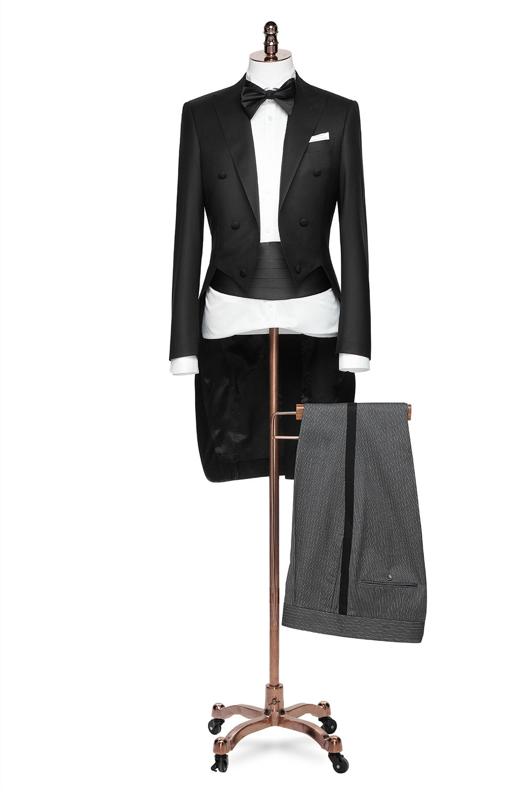 The Midnight Regent Black Tailcoat on a mannequin, full length view with striped trousers