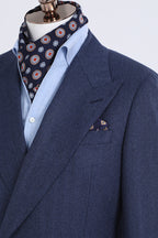 Close-up of the Indigo Prestige suit lapel with pocket square and cravat