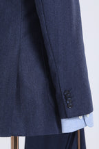 Close-up of the Indigo Prestige suit's sleeve cuff and button detail