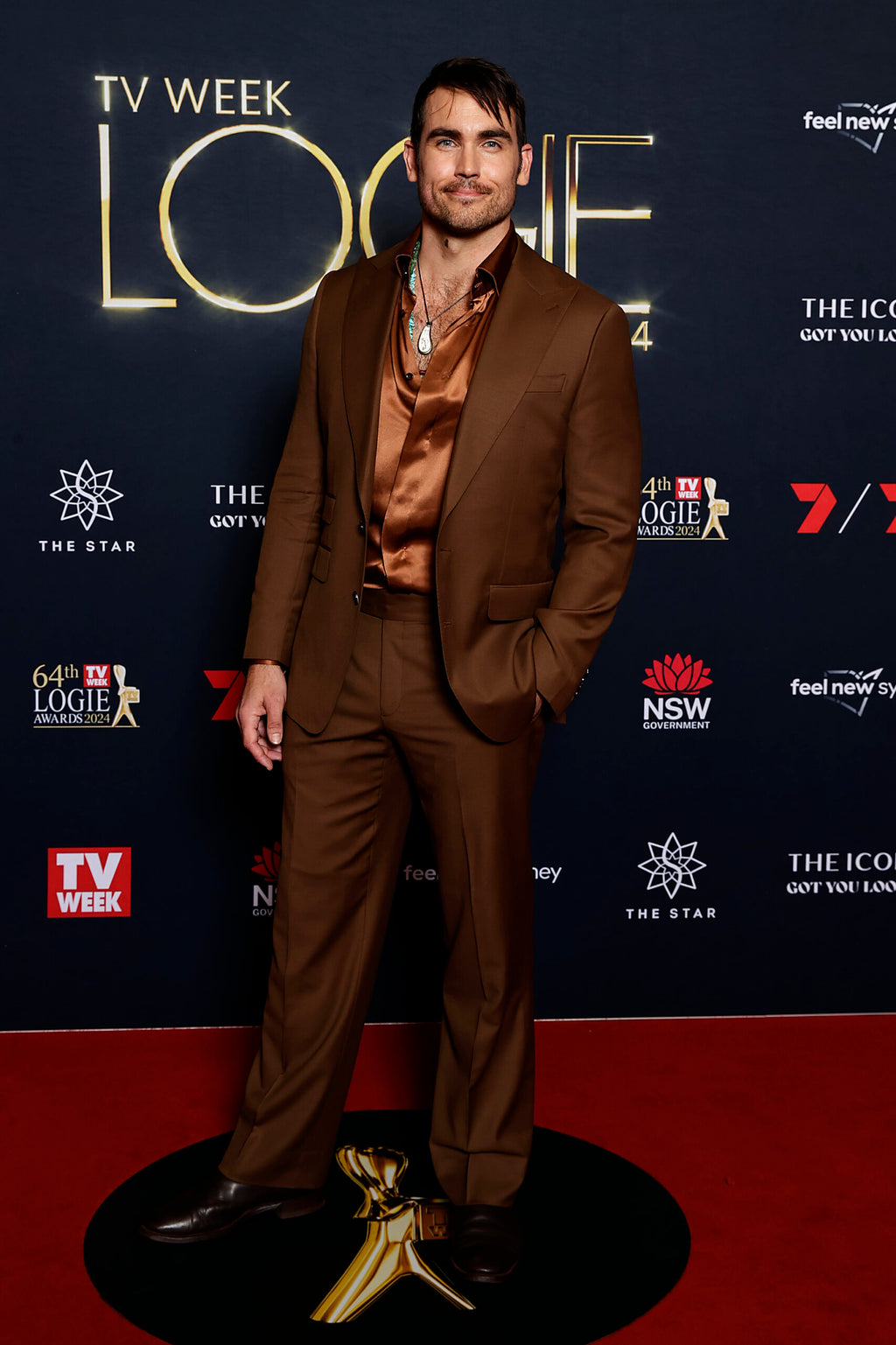 Modern Mellow brown suit worn on a model at a red carpet awards event