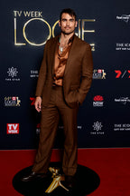 Modern Mellow brown suit worn on a model at a red carpet awards event