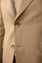 Macro close-up of the button and buttonhole detail on the Ashford suit jacket