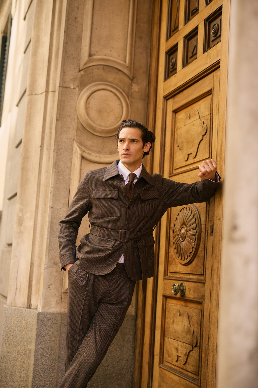 The Hawthorne Brown Jacquard Casual Set worn full-length, hand on a door