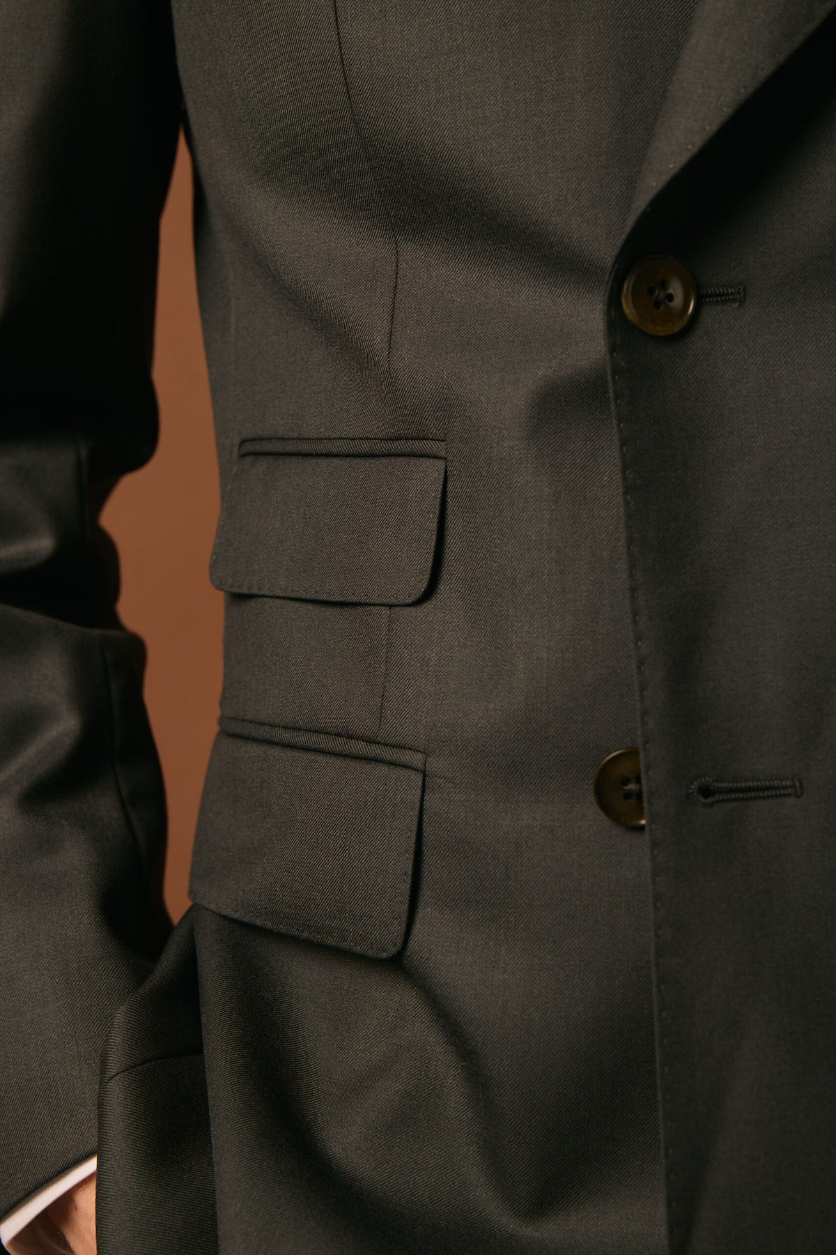 The Whitford Charcoal Suit, close-up of the flap pockets and buttons