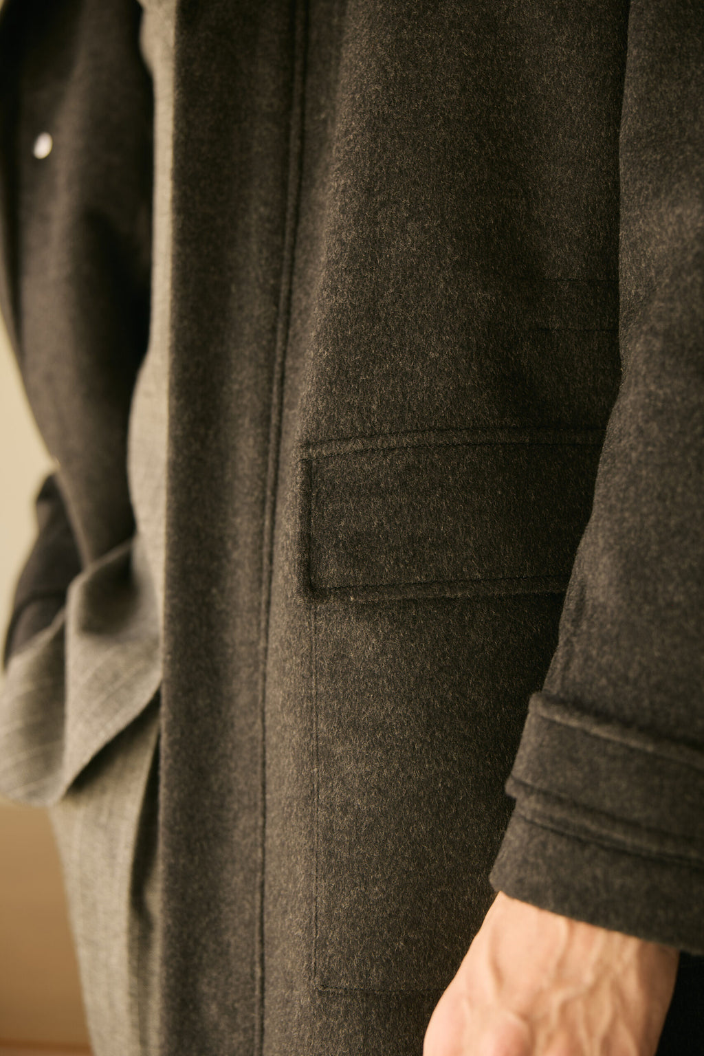 The Ashford Charcoal Overcoat, close-up of the side pocket and cuff