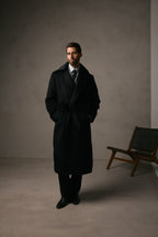 The Lancaster Black Alpaca Blend Overcoat, full-length shot in a dark studio setting