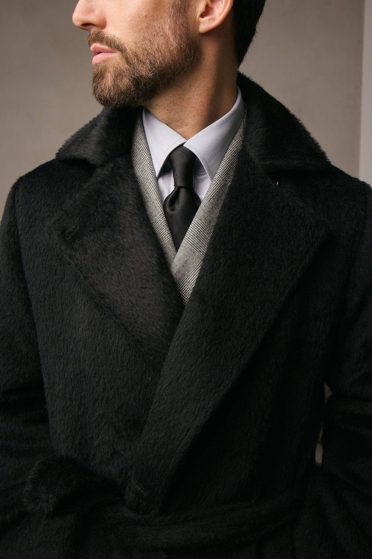 The Lancaster Black Alpaca Blend Overcoat, close-up of the collar over a tie and waistcoat