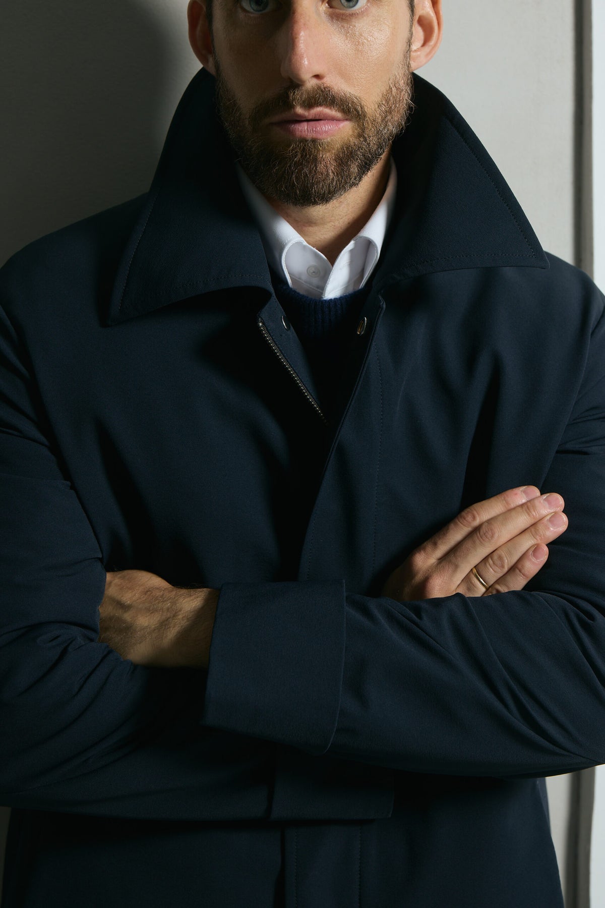 The Ellison Tech Navy Coat, close-up of the collar and zip fastening
