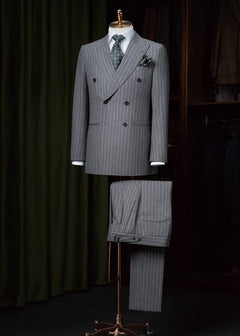 Pensacola Grey Pinstripe Suit displayed on a tailor's dummy with a green tie