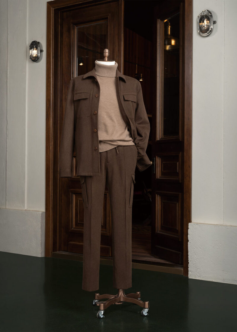Pine Hills Brown Casual Set displayed on a stand outside a dark wood doorway