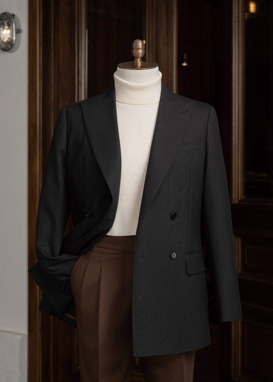 Haddington black jacket worn open on a mannequin over a cream turtleneck