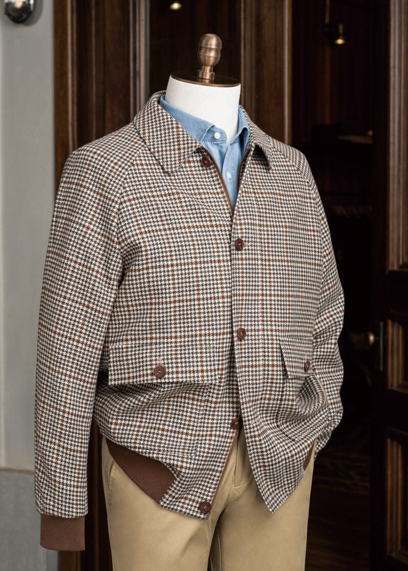 Patission Espresso Houndstooth Sport Jacket displayed on a mannequin outside a shop doorway