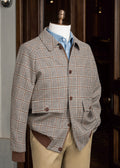 Patission Espresso Houndstooth Sport Jacket displayed on a mannequin outside a shop doorway