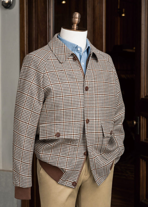 Patission Espresso Houndstooth Sport Jacket displayed on a mannequin outside a shop doorway
