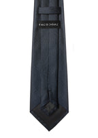 Amsterdam Silk Tie in midnight blue, angled flat lay showing the THEODORE label