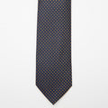 Chicago Tie in blue and gold micro polka dots, flat lay front view