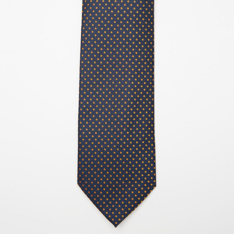 Chicago Tie in blue and gold micro polka dots, flat lay front view