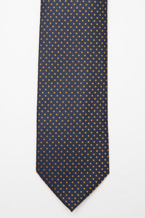 Chicago Tie in blue and gold micro polka dots, flat lay front view