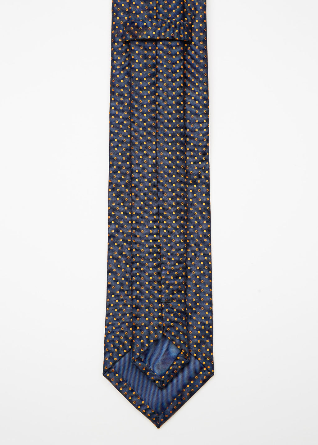 Chicago Tie, angled flat lay with the tip turned back to show the lining