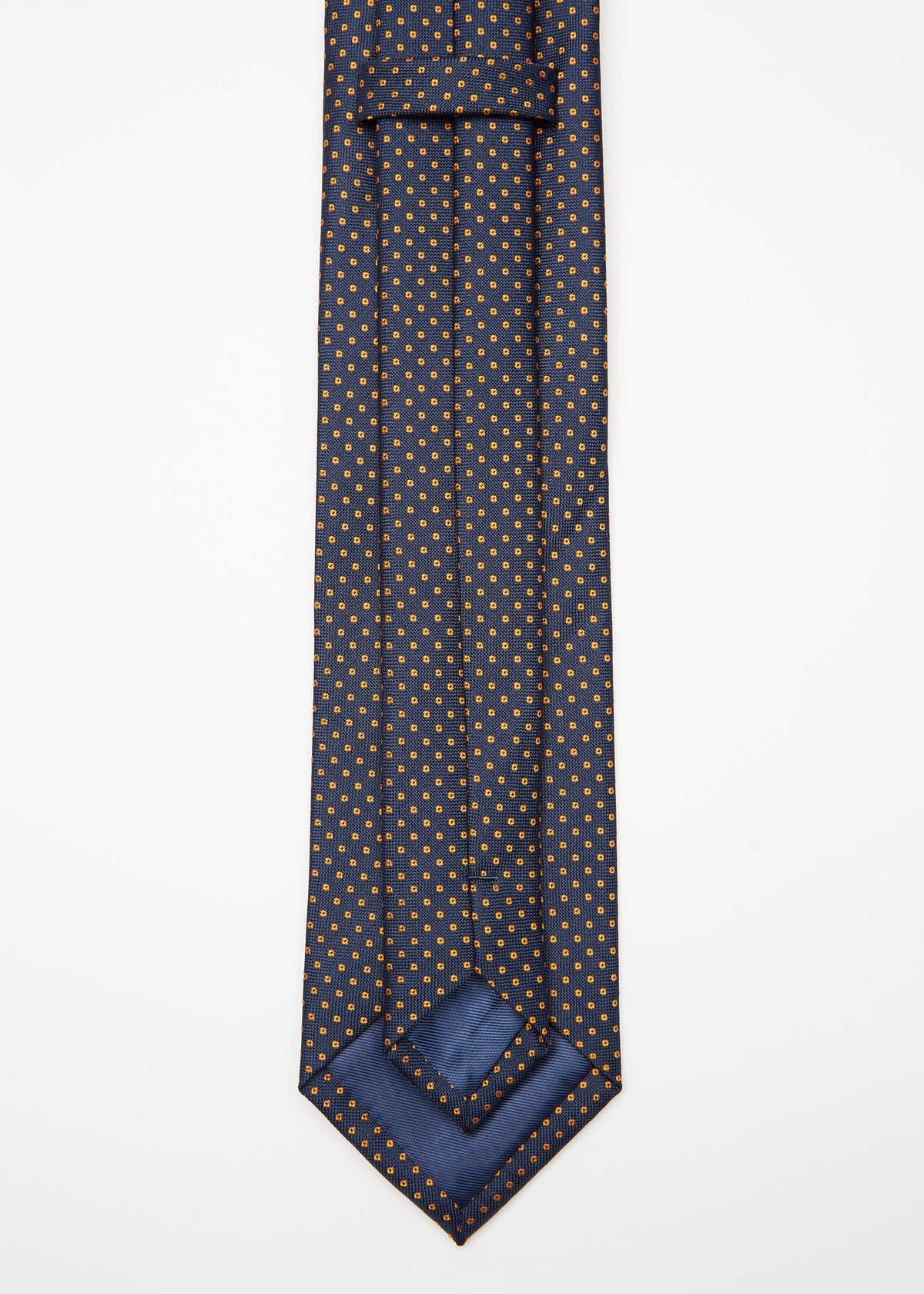 Chicago Tie, angled flat lay with the tip turned back to show the lining