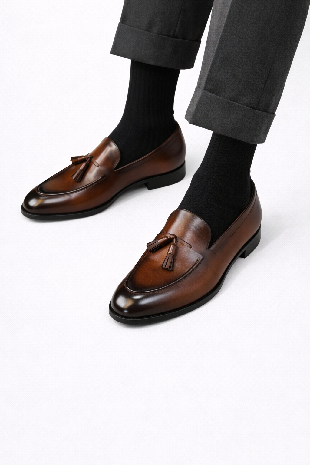 Lukas Light Brown Leather Tassel Loafer worn on a model with grey trousers