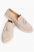 The Porto Beige Suede Tassel Loafer in stone suede, angled pair view