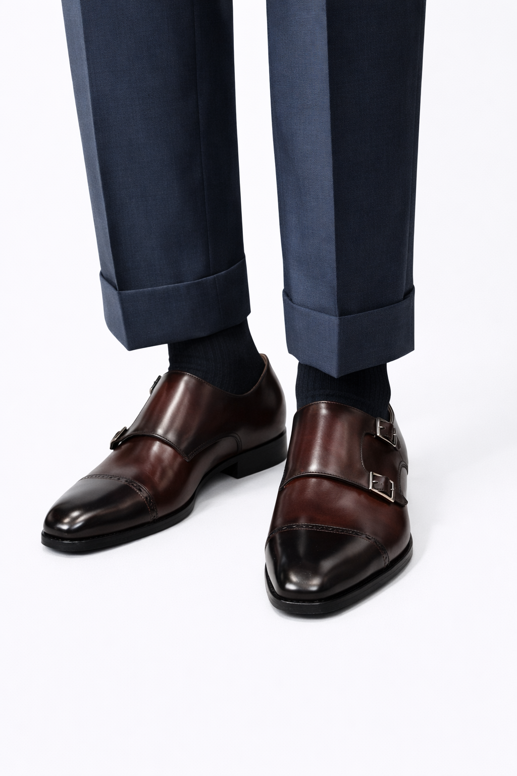 The Friar Burgundy Leather Double Monk worn on a model's feet, double buckle detail visible