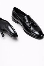 Lukas Black Leather Tassel Loafer, pair shown in a still-life on a plain background