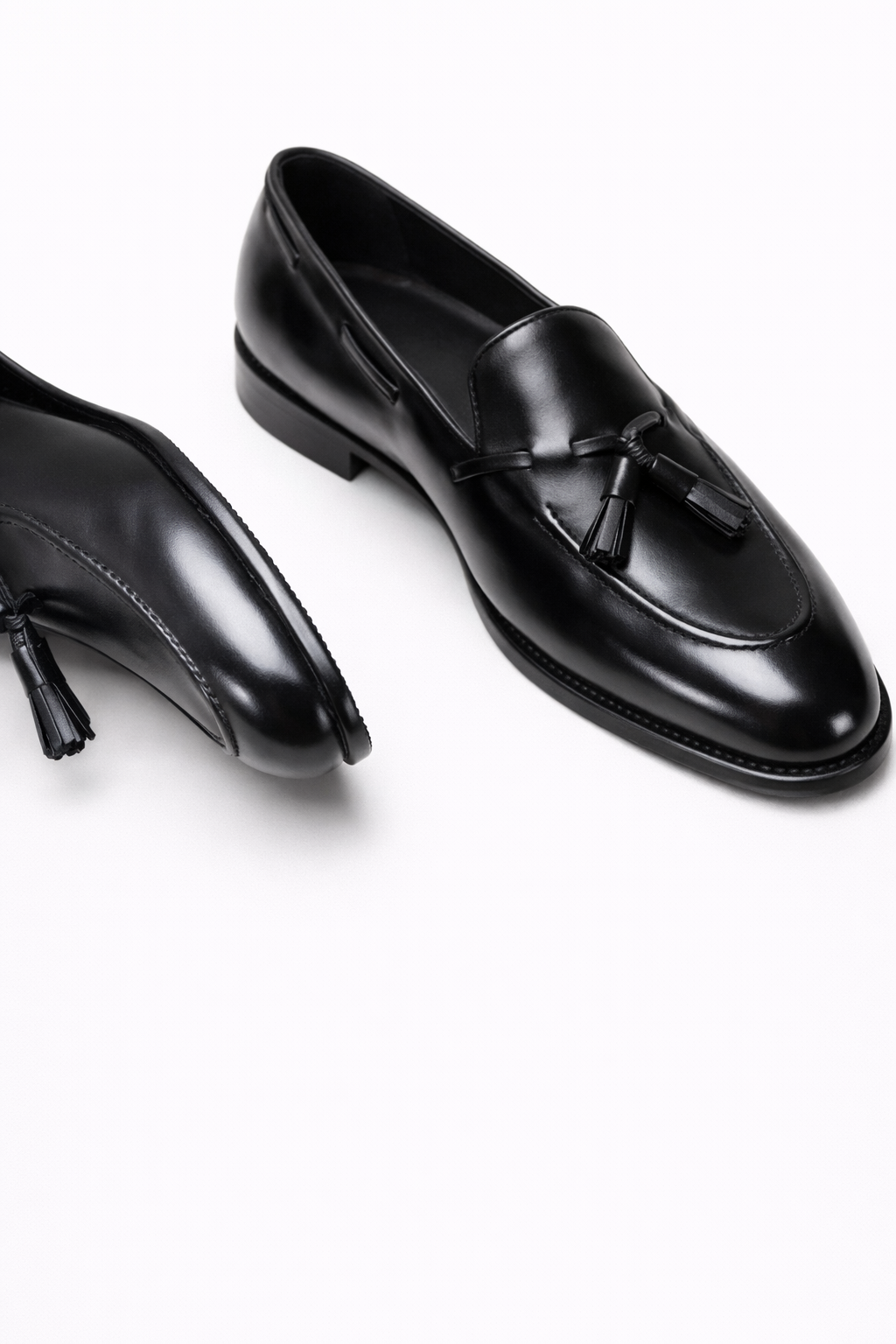 Lukas Black Leather Tassel Loafer, pair shown in a still-life on a plain background