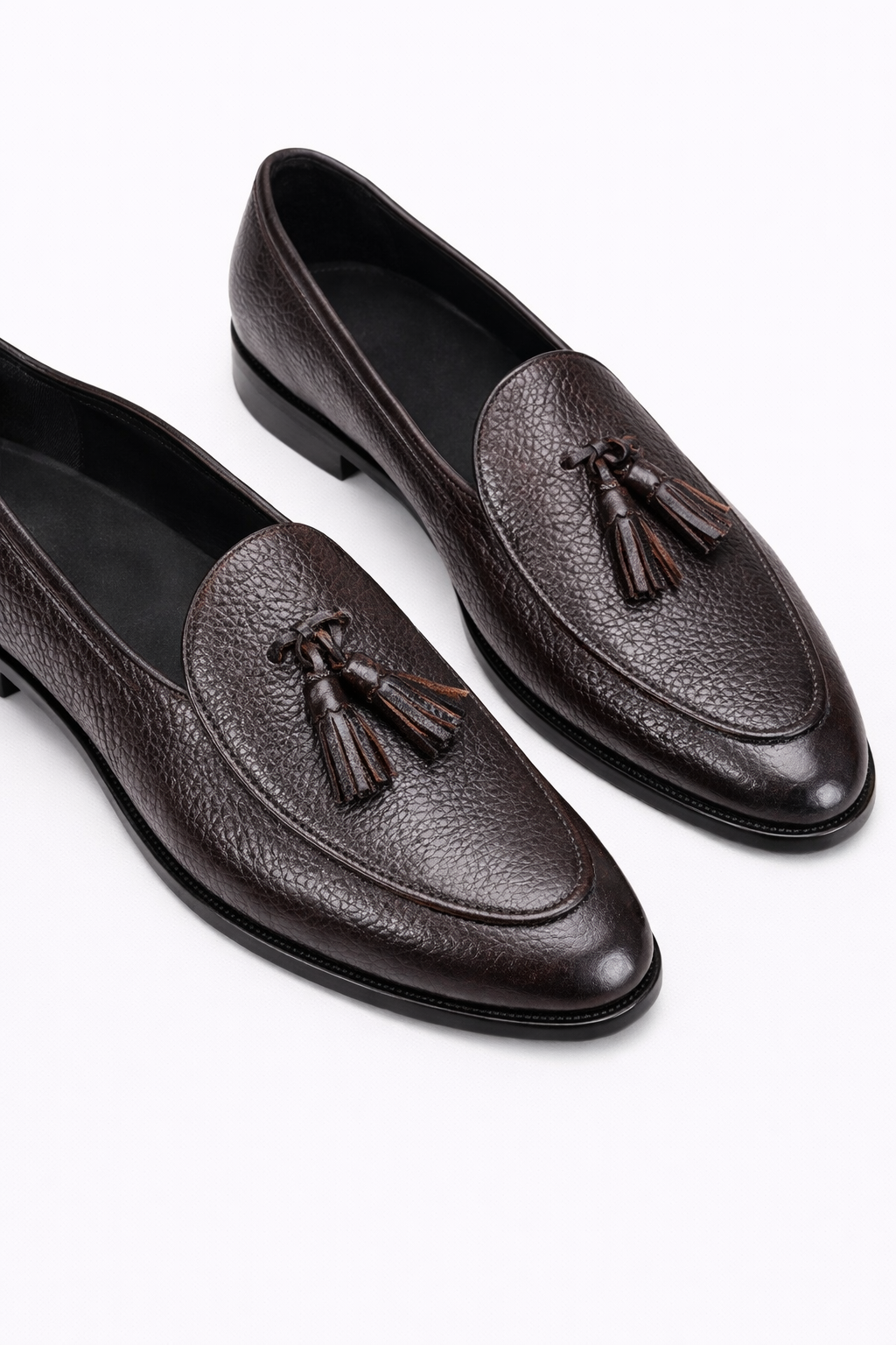 The Porto Soft Leather Tassel Loafers in dark brown pebbled leather, angled pair view