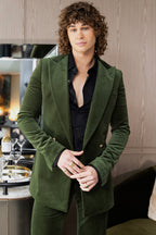 Retro Emerald Velvet Tuxedo worn by a model indoors near a bar cart