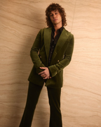 Retro Emerald Velvet Tuxedo worn full-length against a marble wall