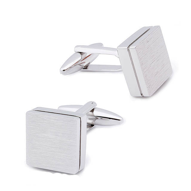 Times Square Silver Cufflinks, a pair of brushed square cufflinks on a plain background