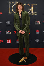 Retro Emerald Velvet Tuxedo worn by a model on a red carpet, front view