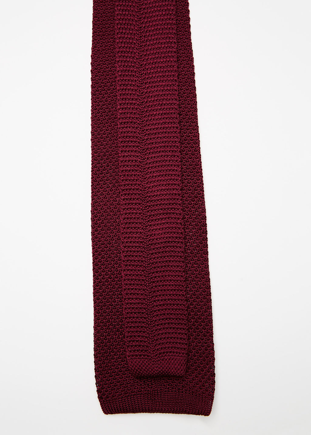Paris Silk Knit Tie in burgundy, close-up flat lay arranged diagonally
