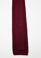 Paris Silk Knit Tie in burgundy, close-up flat lay arranged diagonally